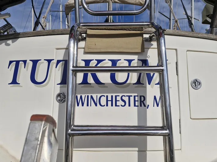 Tutkum Yacht Photos Pics Sailboat stern with ladder, Tayana 48, 2007, named "Tutkum," Winchester, MA.