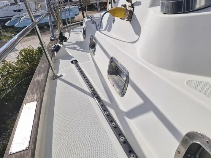 Tutkum Yacht Photos Pics Deck view of 2007 Tayana 48 sailboat, showcasing sleek design and stainless steel fittings.