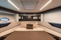 Luxurious interior cabin of 2021 Pershing 8X yacht with modern design and ambient lighting.