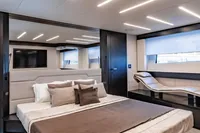 Luxurious bedroom interior of 2021 Pershing 8X yacht with modern lighting and sleek design.