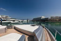 Luxury Pershing 8X yacht docked in a serene marina, 2021 model.