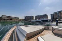 Luxury Pershing 8X yacht docked in a modern marina, 2021 model.