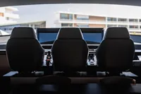 Interior cockpit of 2021 Pershing 8X yacht with three seats and control panels.