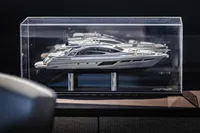 Model of a 2021 Pershing 8X yacht displayed in a clear case.