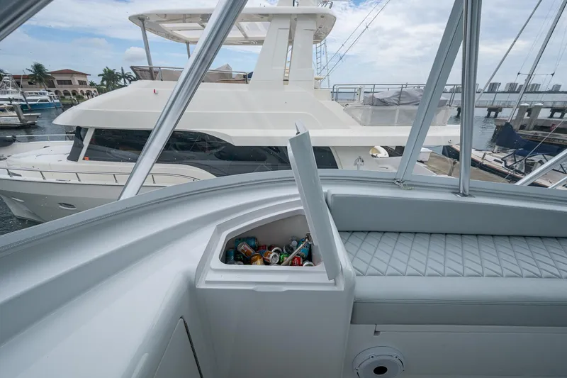 Ebitda Yacht Photos Pics 2009 Viking 60 Convertible yacht interior with open cooler, docked near other boats.