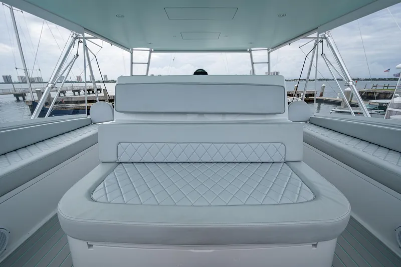 Ebitda Yacht Photos Pics Luxurious seating on 2009 Viking 60 Convertible yacht, docked with scenic waterfront view.