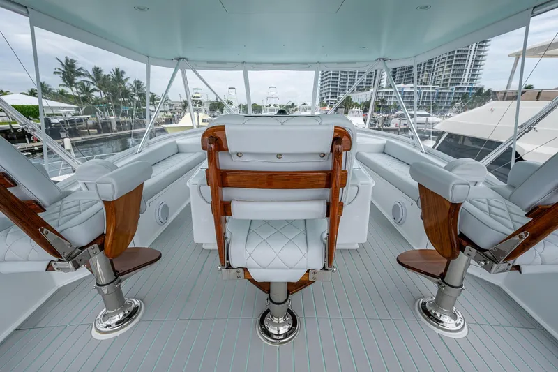 Ebitda Yacht Photos Pics Luxurious interior of 2009 Viking 60 Convertible yacht with elegant seating and panoramic windows.