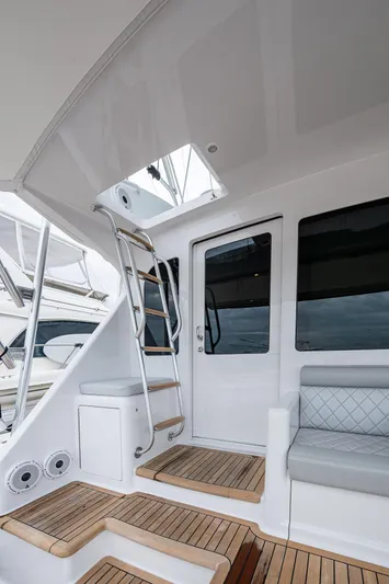 Ebitda Yacht Photos Pics 2009 Viking 60 Convertible yacht with teak steps and sleek interior.