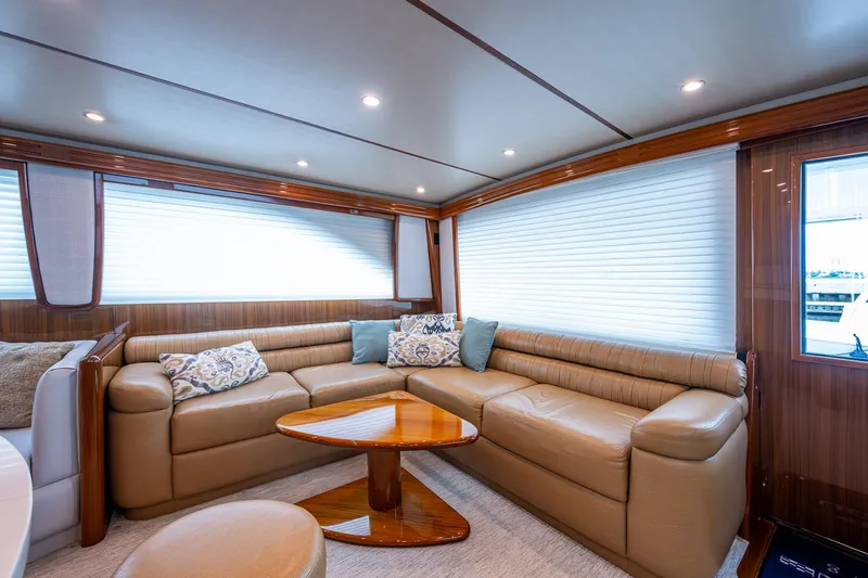 Ebitda Yacht Photos Pics Luxurious interior of 2009 Viking 60 Convertible yacht with plush seating and elegant decor.