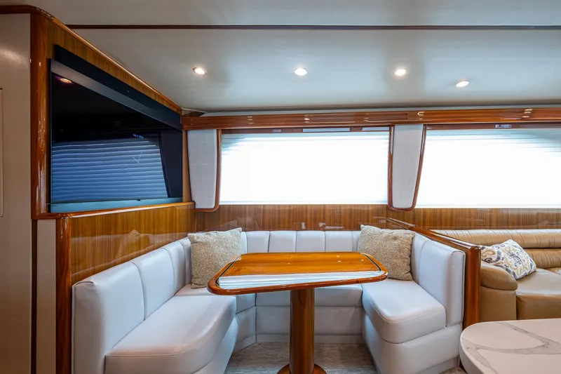 Ebitda Yacht Photos Pics Luxurious interior of 2009 Viking 60 Convertible yacht with plush seating and elegant wood finishes.