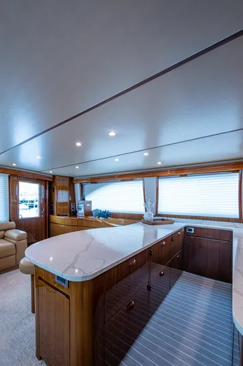 Ebitda Yacht Photos Pics Luxurious interior of 2009 Viking 60 Convertible yacht with elegant wood and marble finishes.