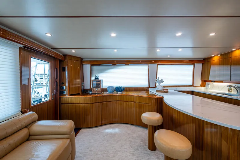 Ebitda Yacht Photos Pics Luxurious interior of 2009 Viking 60 Convertible yacht with elegant wood finishes and modern furnishings.