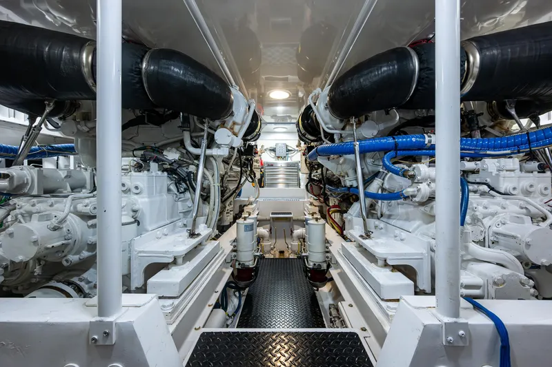 Ebitda Yacht Photos Pics Engine room of 2009 Viking 60 Convertible yacht, showcasing dual engines and mechanical components.