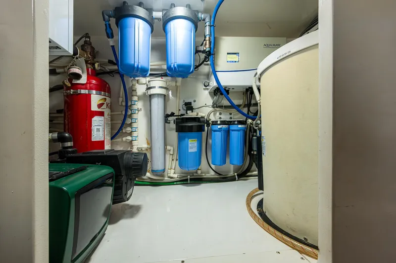 Ebitda Yacht Photos Pics Engine room of 2009 Viking 60 Convertible with water filtration system and fire extinguisher.