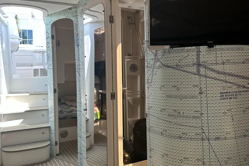  Yacht Photos Pics Interior of 2020 Intrepid 475 Sport Yacht with map decor and modern amenities.