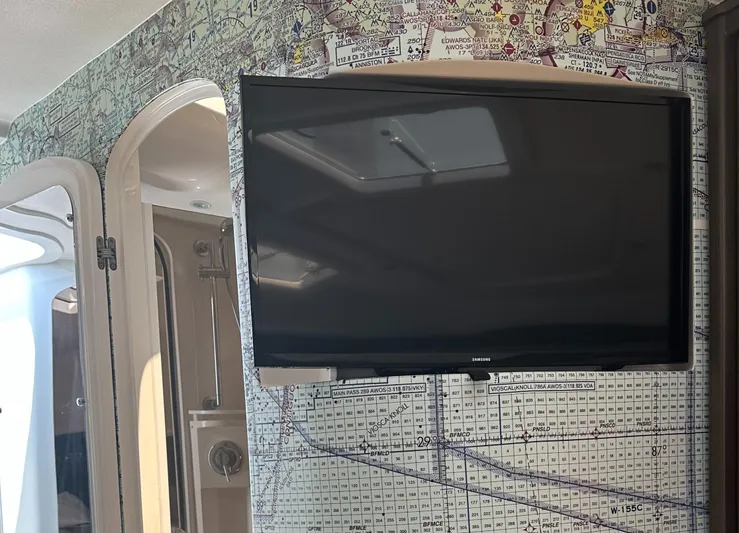  Yacht Photos Pics Flat-screen TV on Intrepid 475 Sport Yacht 2020, with nautical chart wallpaper background.