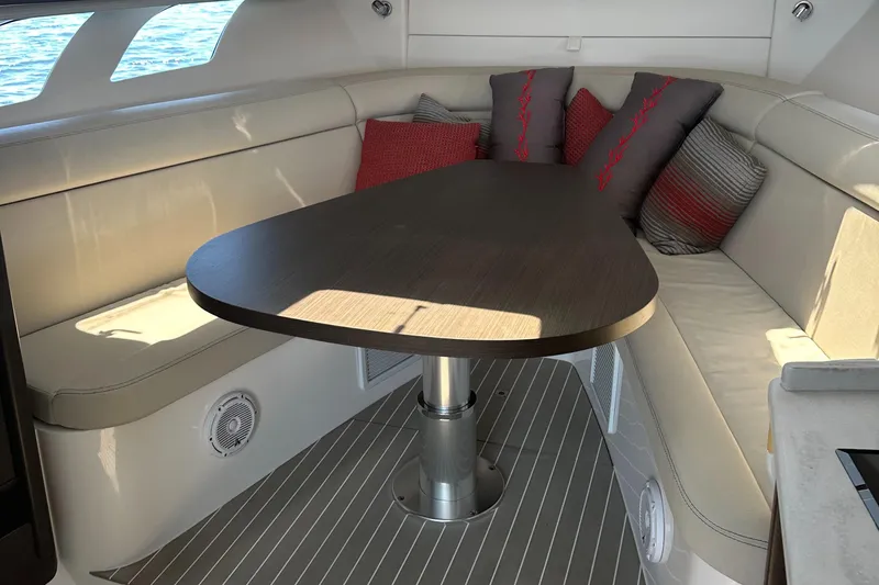  Yacht Photos Pics Luxurious interior of 2020 Intrepid 475 Sport Yacht with elegant seating and table.