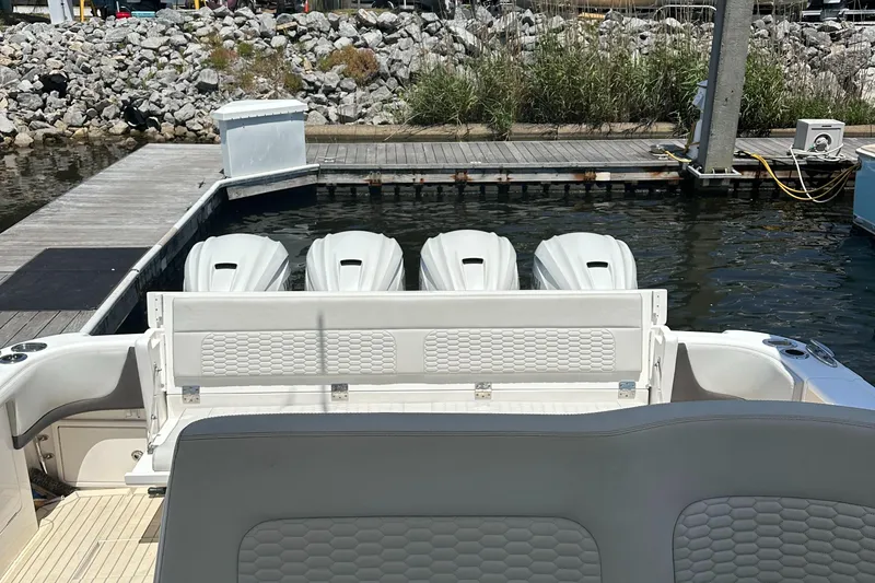  Yacht Photos Pics 2020 Intrepid 475 Sport Yacht with four powerful outboard engines docked at marina.