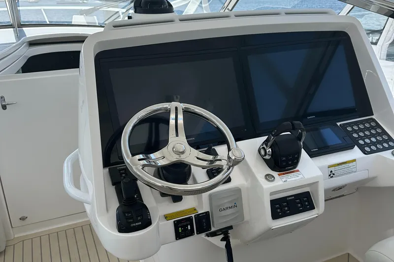  Yacht Photos Pics Helm of 2020 Intrepid 475 Sport Yacht with Garmin displays and steering wheel.