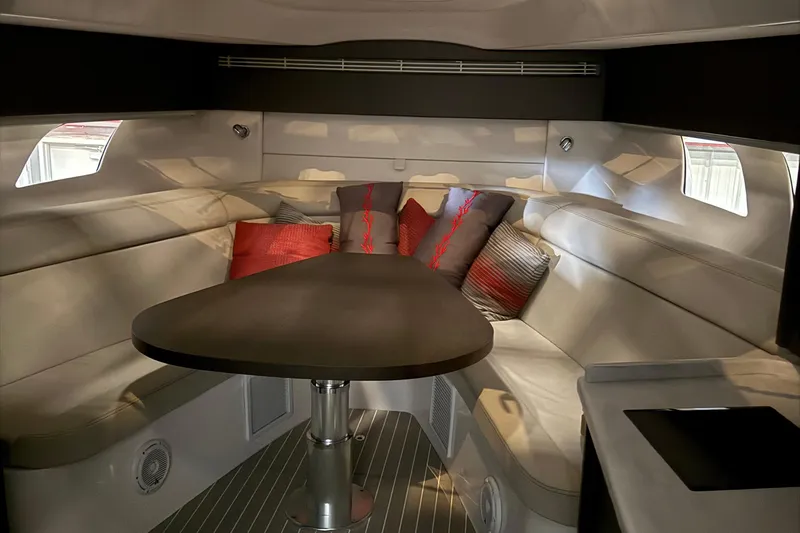  Yacht Photos Pics Luxurious interior of 2020 Intrepid 475 Sport Yacht with plush seating and elegant table.