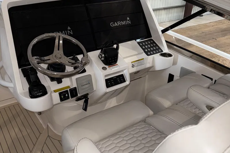  Yacht Photos Pics 2020 Intrepid 475 Sport Yacht helm with Garmin navigation and luxurious seating.