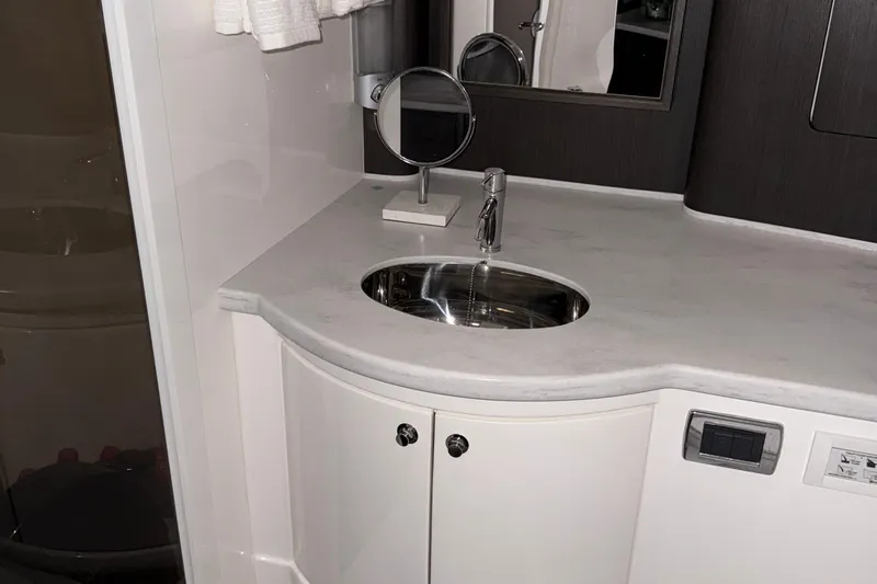  Yacht Photos Pics Luxury bathroom sink in 2020 Intrepid 475 Sport Yacht, featuring modern fixtures and sleek design.