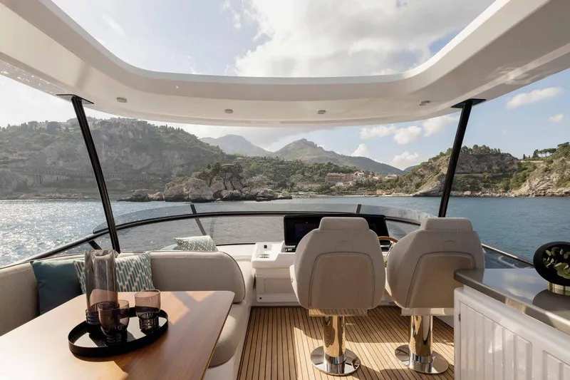  Yacht Photos Pics Luxurious 2024 Azimut Magellano 60 yacht interior with scenic ocean view.