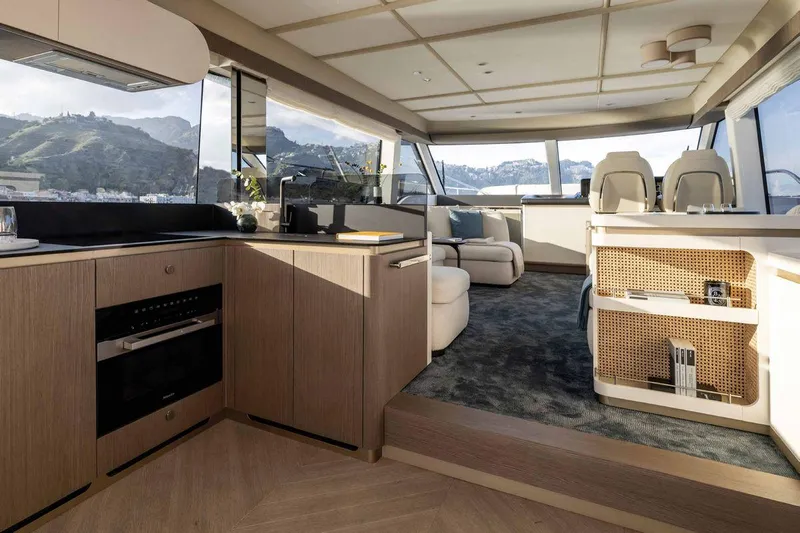  Yacht Photos Pics Luxurious interior of 2024 Azimut Magellano 60 yacht with modern kitchen and seating area.