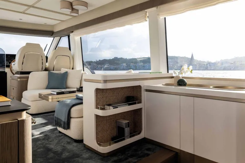  Yacht Photos Pics Luxurious interior of 2024 Azimut Magellano 60 yacht with elegant seating and panoramic windows.