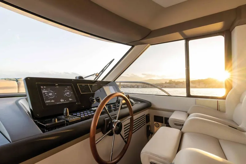  Yacht Photos Pics 2024 Azimut Magellano 60 yacht helm with sunset view, featuring modern controls and luxurious seating.