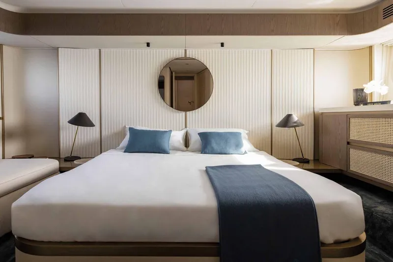  Yacht Photos Pics Luxurious bedroom interior of 2024 Azimut Magellano 60 yacht with modern decor.