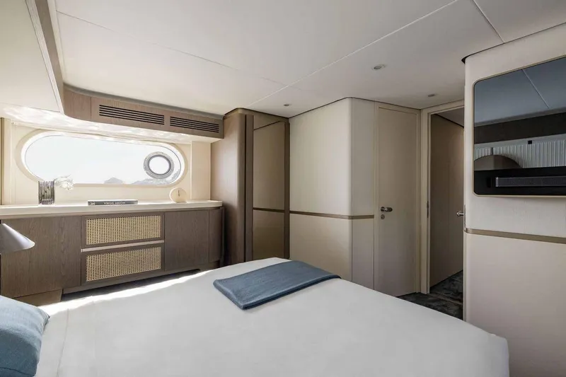  Yacht Photos Pics Luxurious bedroom interior of 2024 Azimut Magellano 60 yacht, featuring modern design and elegant furnishings.