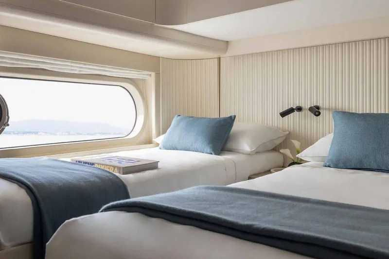  Yacht Photos Pics Luxurious twin cabin in 2024 Azimut Magellano 60 yacht with ocean view.