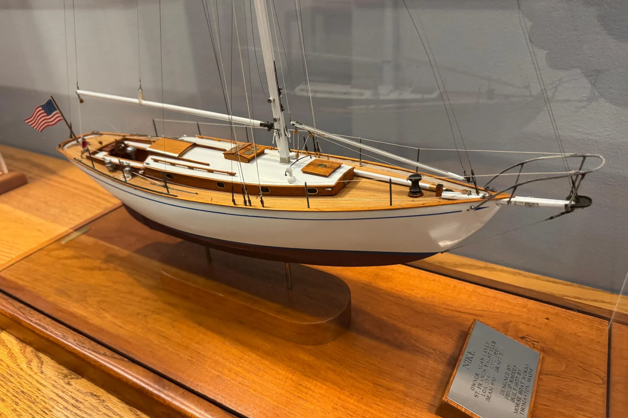 Model of a 1938 Philip Rhodes Cutter sailboat on display with detailed craftsmanship.
