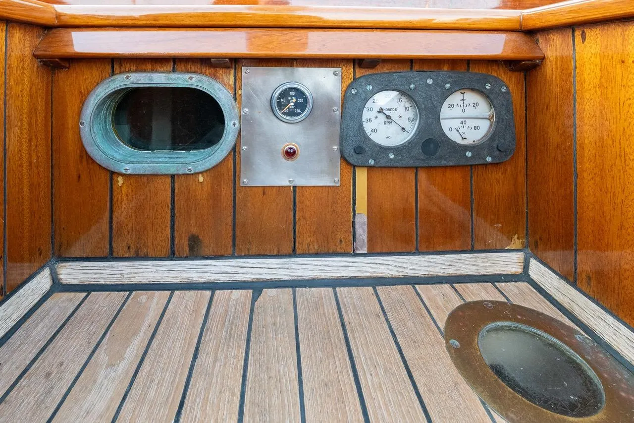 1938 Philip Rhodes Cutter interior with vintage gauges and wooden paneling.