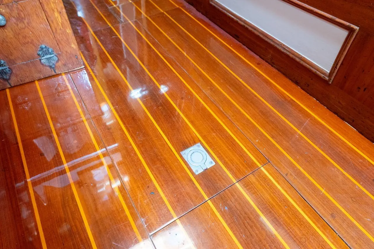 Polished wooden floor of 1938 Philip Rhodes Cutter boat interior.
