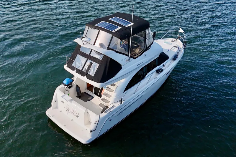  Yacht Photos Pics 2003 Meridian 341 Sedan yacht with solar panels on open water.