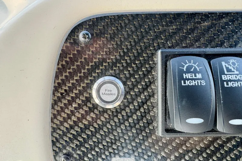  Yacht Photos Pics Carbon fiber panel with "Fire Missiles" button on 2003 Meridian 341 Sedan.