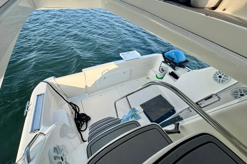  Yacht Photos Pics 2003 Meridian 341 Sedan boat deck with ocean view, featuring seating and a small grill.