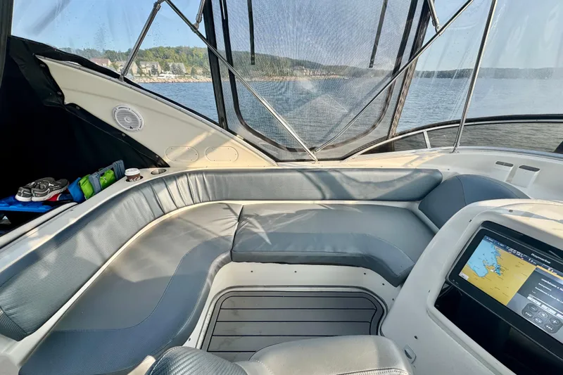  Yacht Photos Pics Interior of a 2003 Meridian 341 Sedan yacht with seating and navigation display.