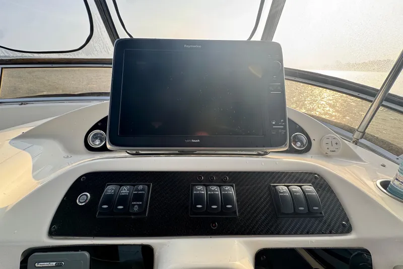  Yacht Photos Pics Control panel of a 2003 Meridian 341 Sedan boat with navigation display.
