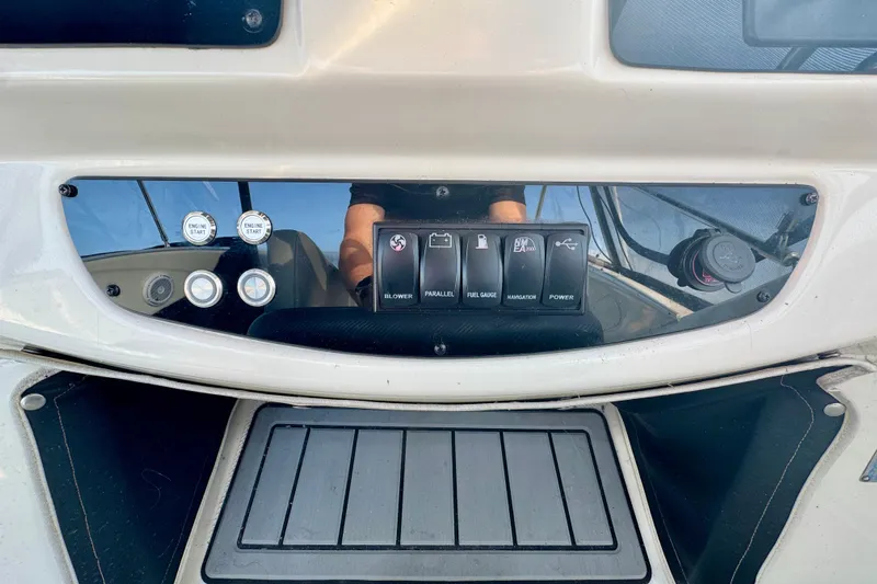  Yacht Photos Pics Control panel of a 2003 Meridian 341 Sedan boat with various switches and gauges.