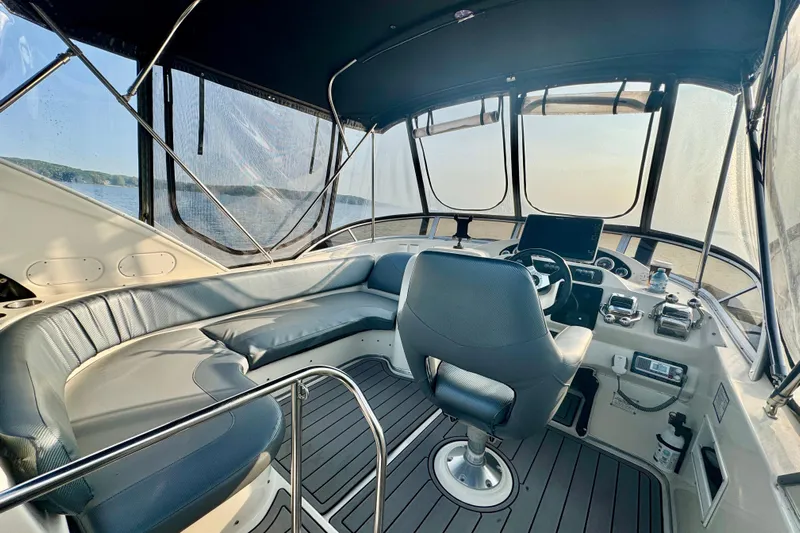  Yacht Photos Pics 2003 Meridian 341 Sedan interior with helm, seating, and panoramic windows.