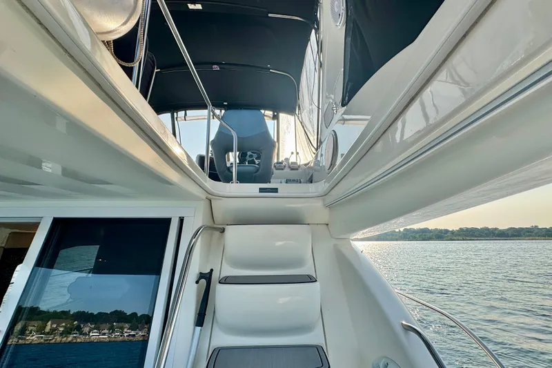  Yacht Photos Pics 2003 Meridian 341 Sedan yacht interior with view of water and seating area.