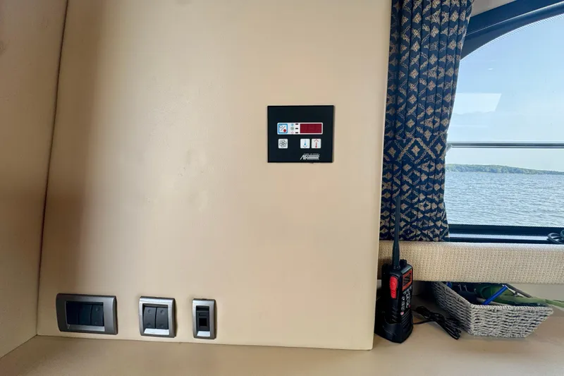  Yacht Photos Pics Interior of a 2003 Meridian 341 Sedan yacht with control panel and window view.