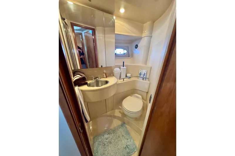  Yacht Photos Pics Bathroom interior of 2003 Meridian 341 Sedan yacht, featuring sink and toilet.