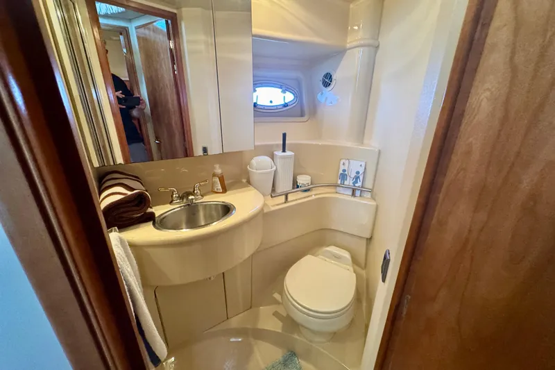  Yacht Photos Pics Bathroom interior of 2003 Meridian 341 Sedan yacht, featuring sink and toilet.