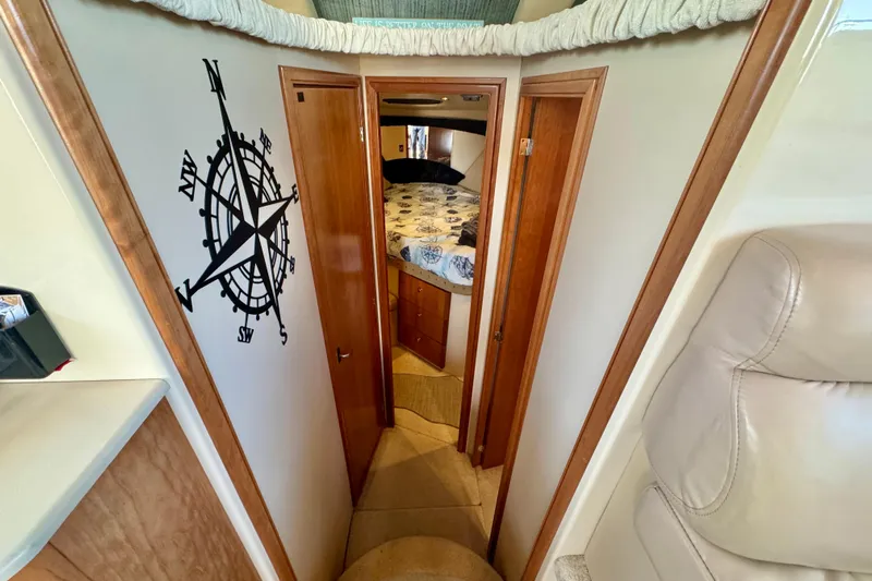  Yacht Photos Pics Interior of 2003 Meridian 341 Sedan with compass wall art and cozy bedroom.