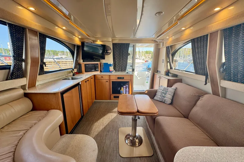  Yacht Photos Pics Luxurious interior of a 2003 Meridian 341 Sedan yacht with cozy seating and modern amenities.