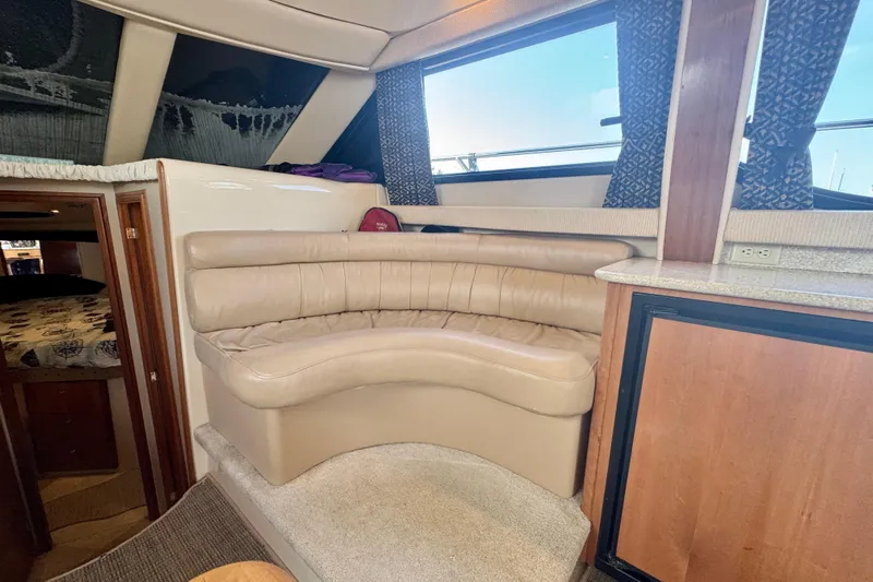  Yacht Photos Pics Interior of 2003 Meridian 341 Sedan with beige leather seating and wood accents.